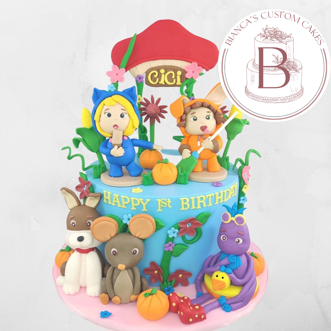 kids cartoon cake with multiple fondant figurines, lots of colors and details