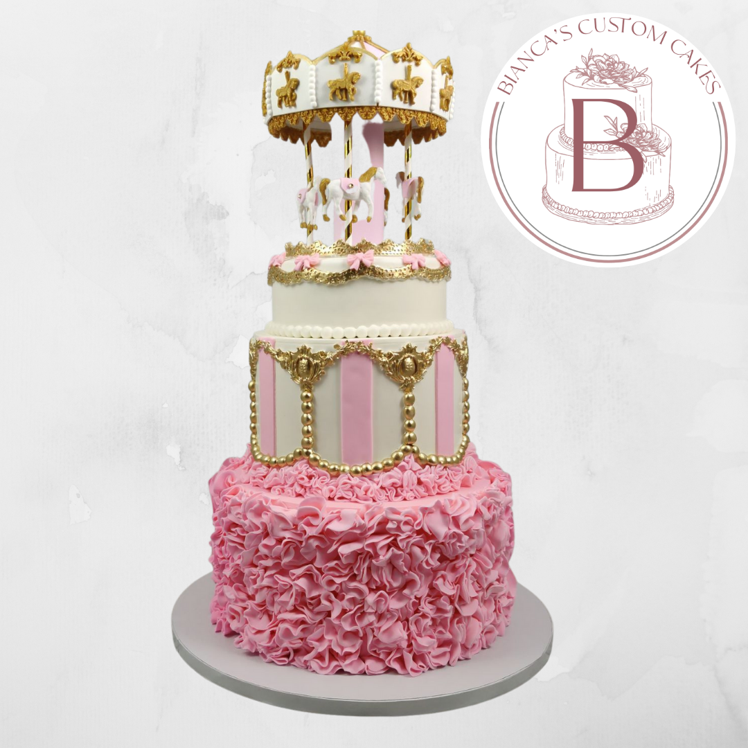 pink and white carousel themed cake with gold accents and custom carousel cake topper